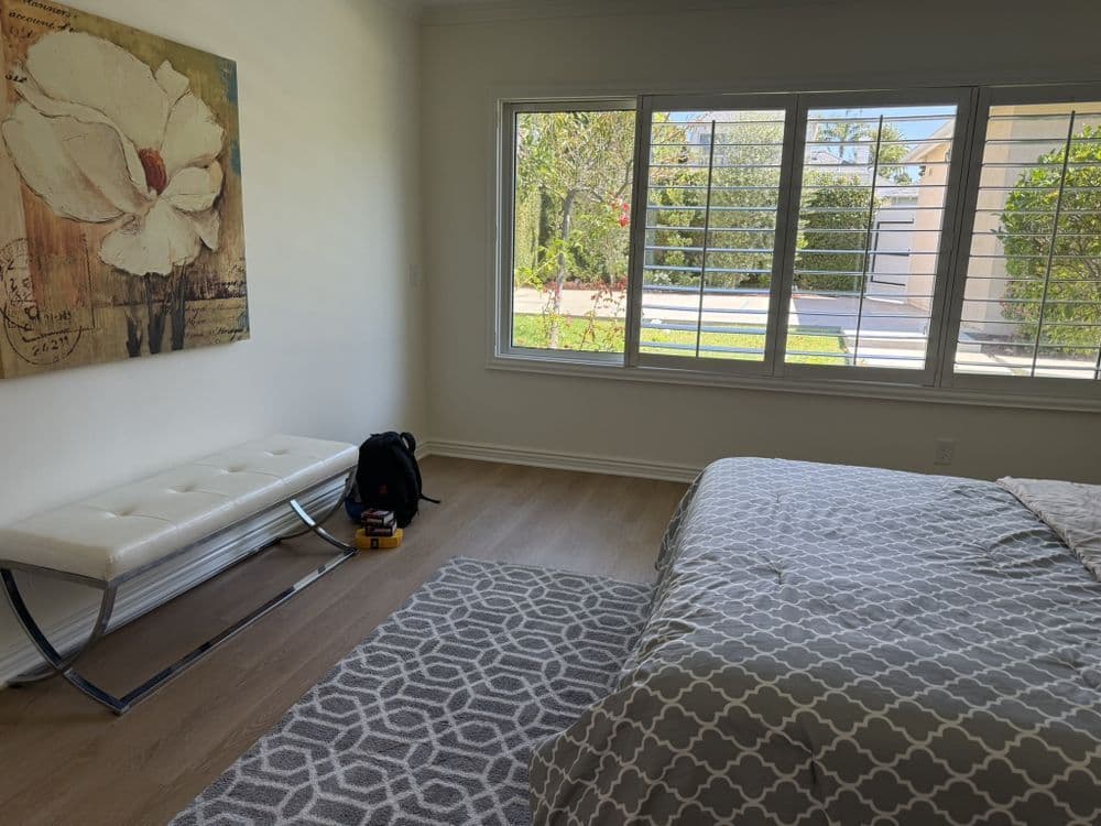 White plantation shutters on a bedroom window