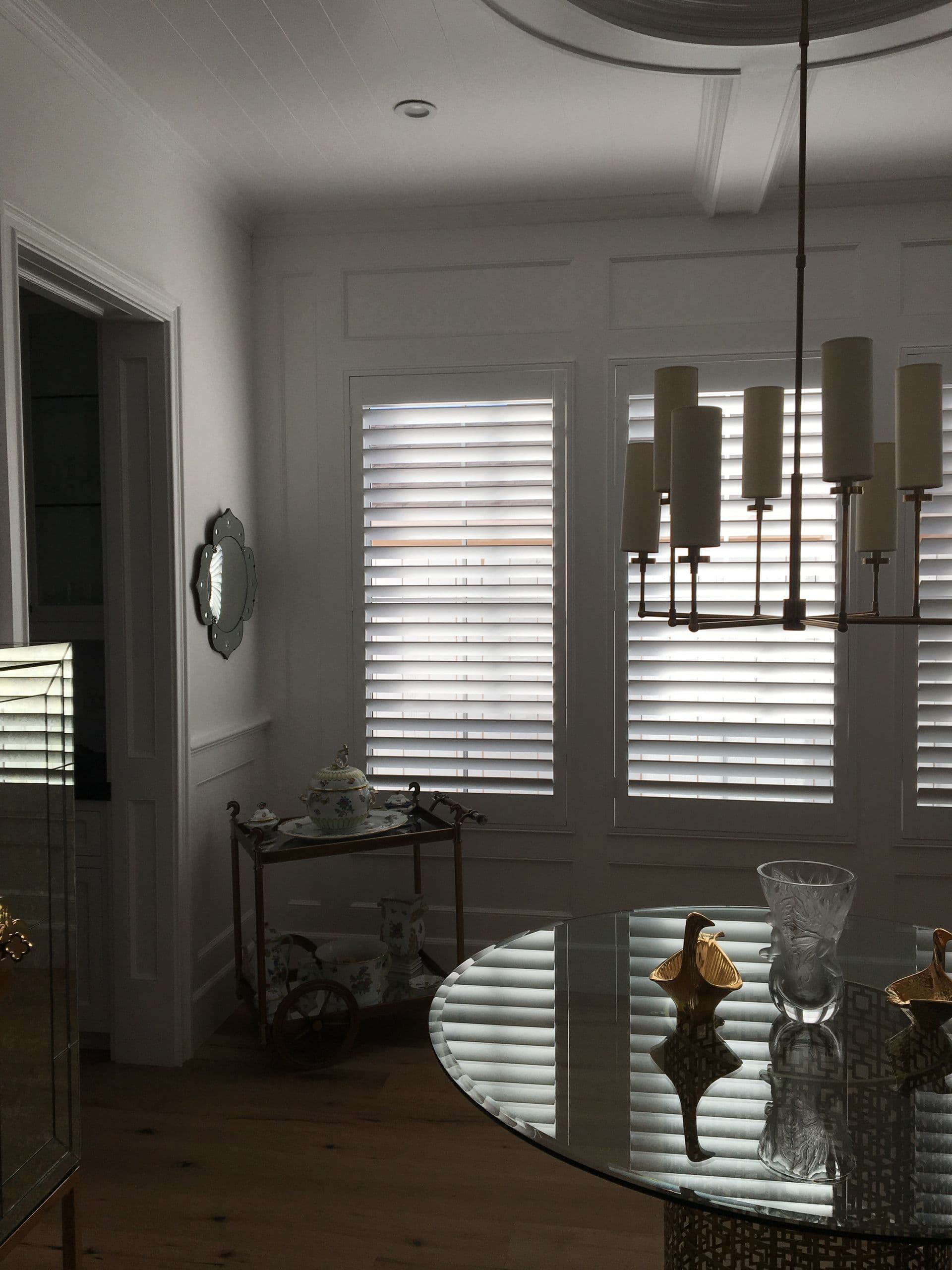 House window with plantation-style shutters