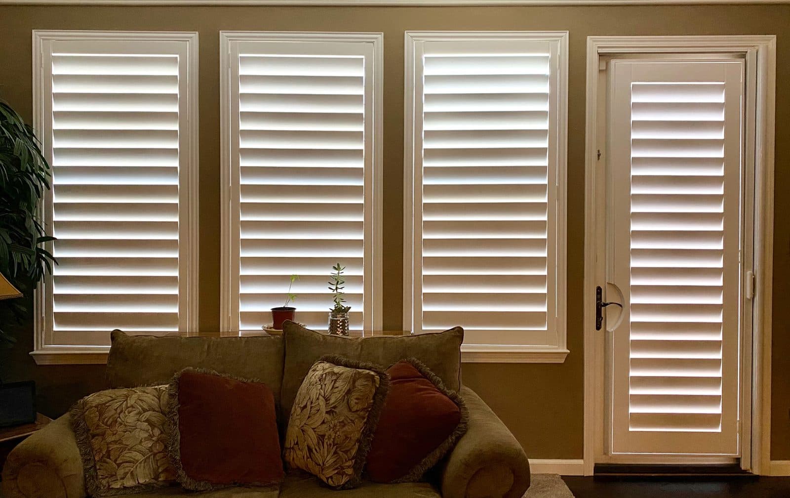 Honeycomb cellular shade partly lowered on a sliding glass door