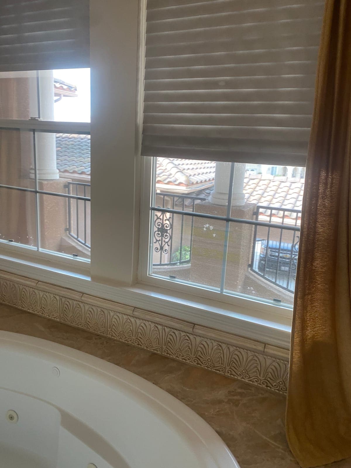 Close-up of white plantation shutter louvers with a gap in the row