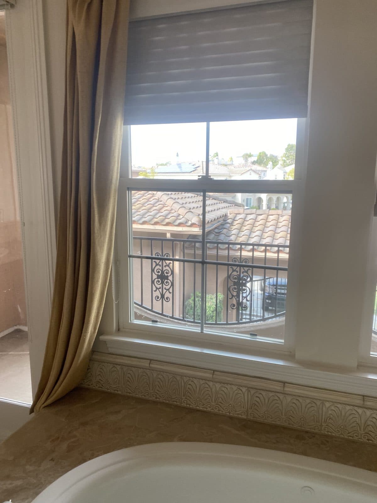 Close-up of white plantation shutter louvers and the tilt rod. Real AAA Shutter Repair job photo.